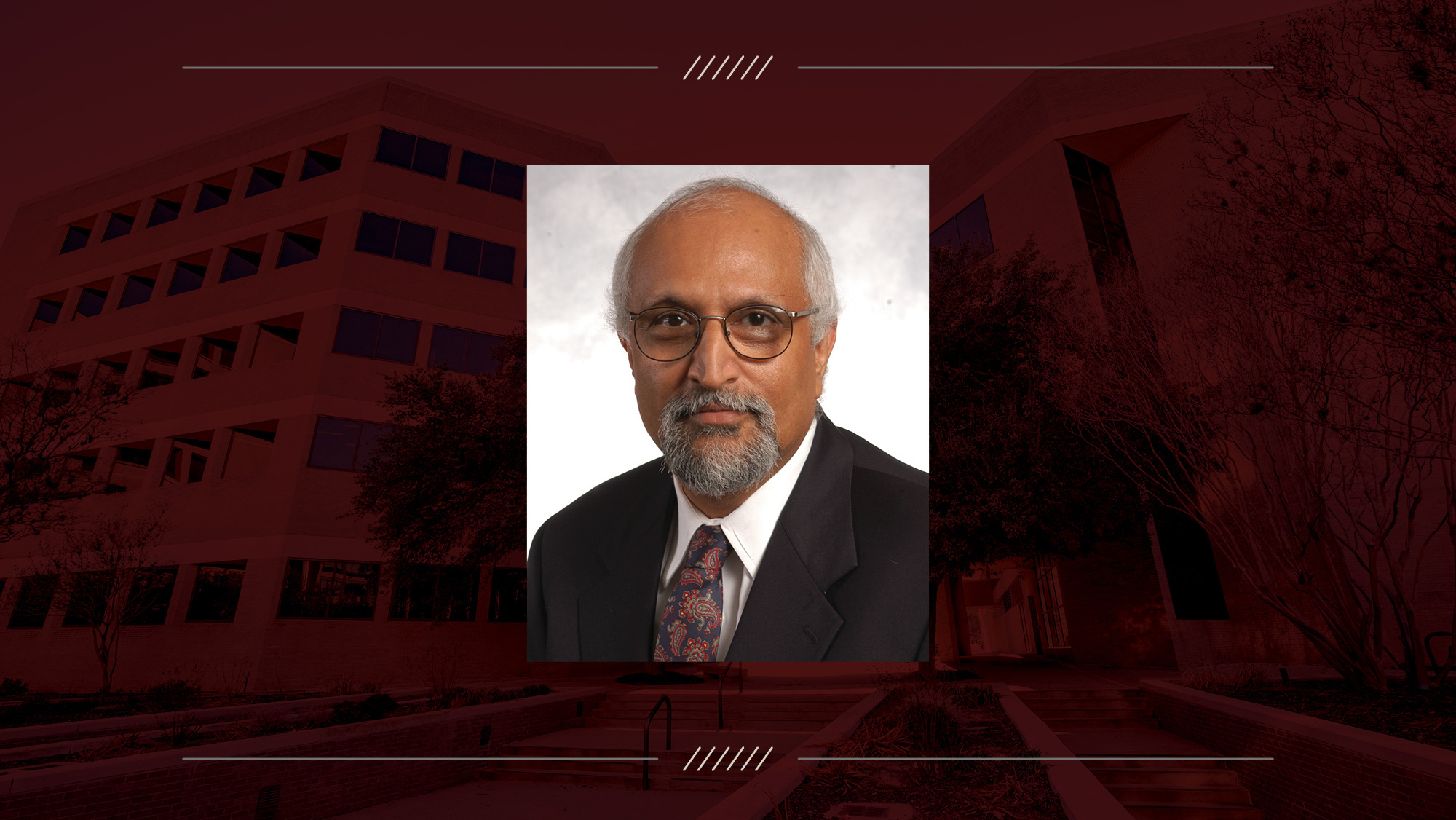 Headshot of Dr. Kumbakonam Rajagopal on maroon background.