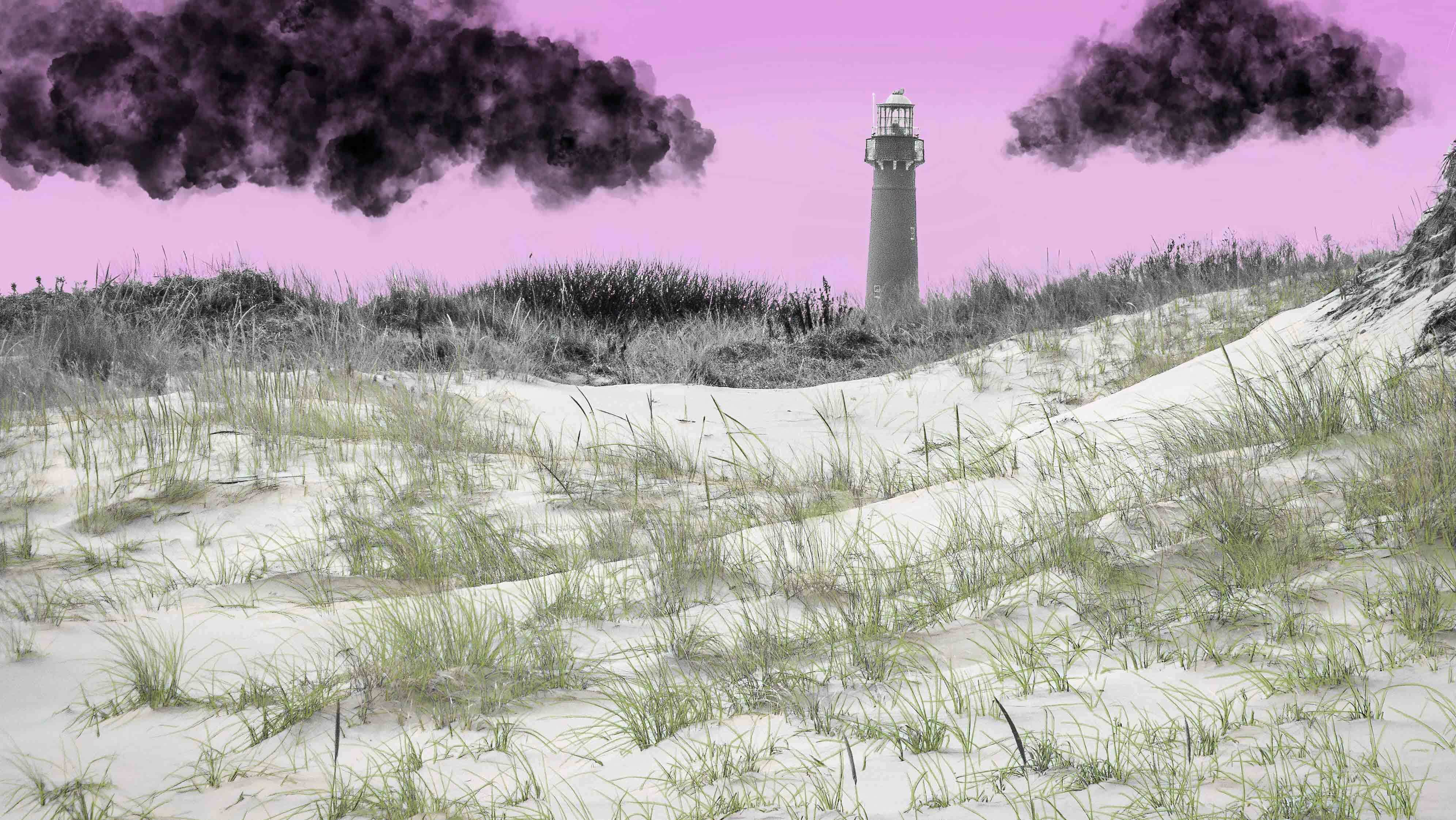 A lighthouse on a grassy beach with a purple sky and black clouds.