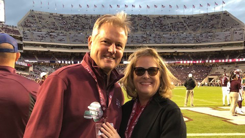Man and woman on a football field.
