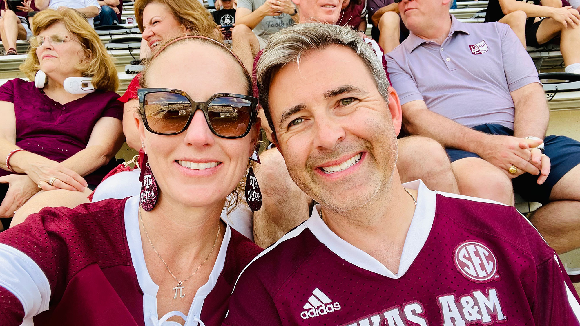 Man and woman smile in a selfie.