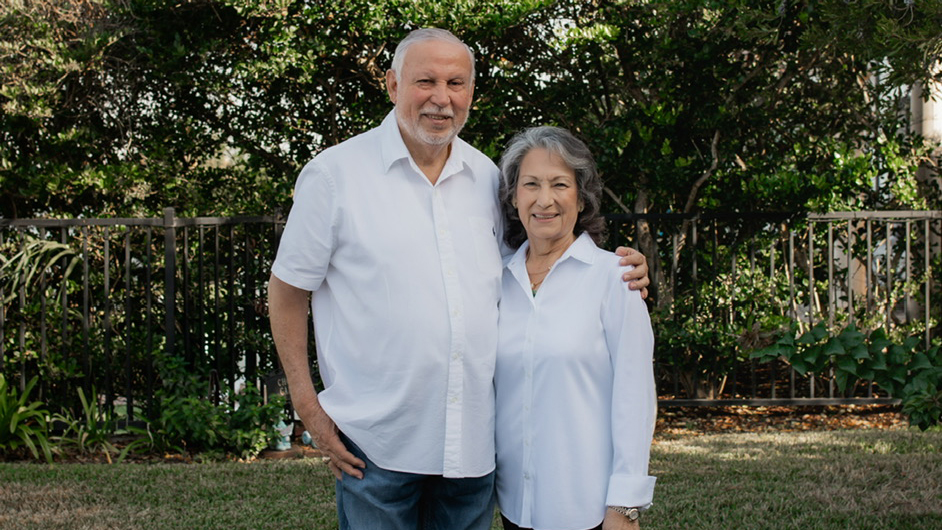 A couple posing for a photo. 
