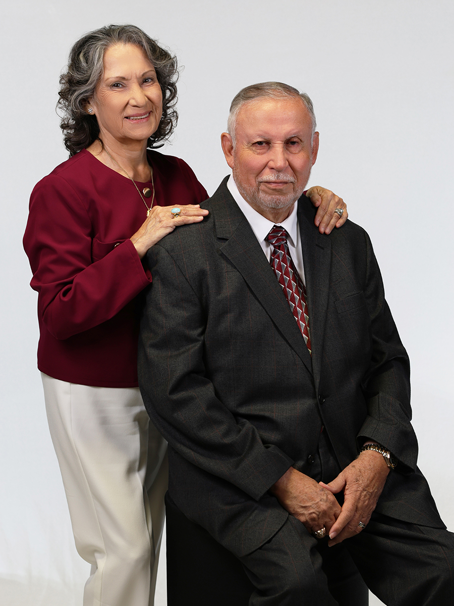 A couple posing for a photo. 