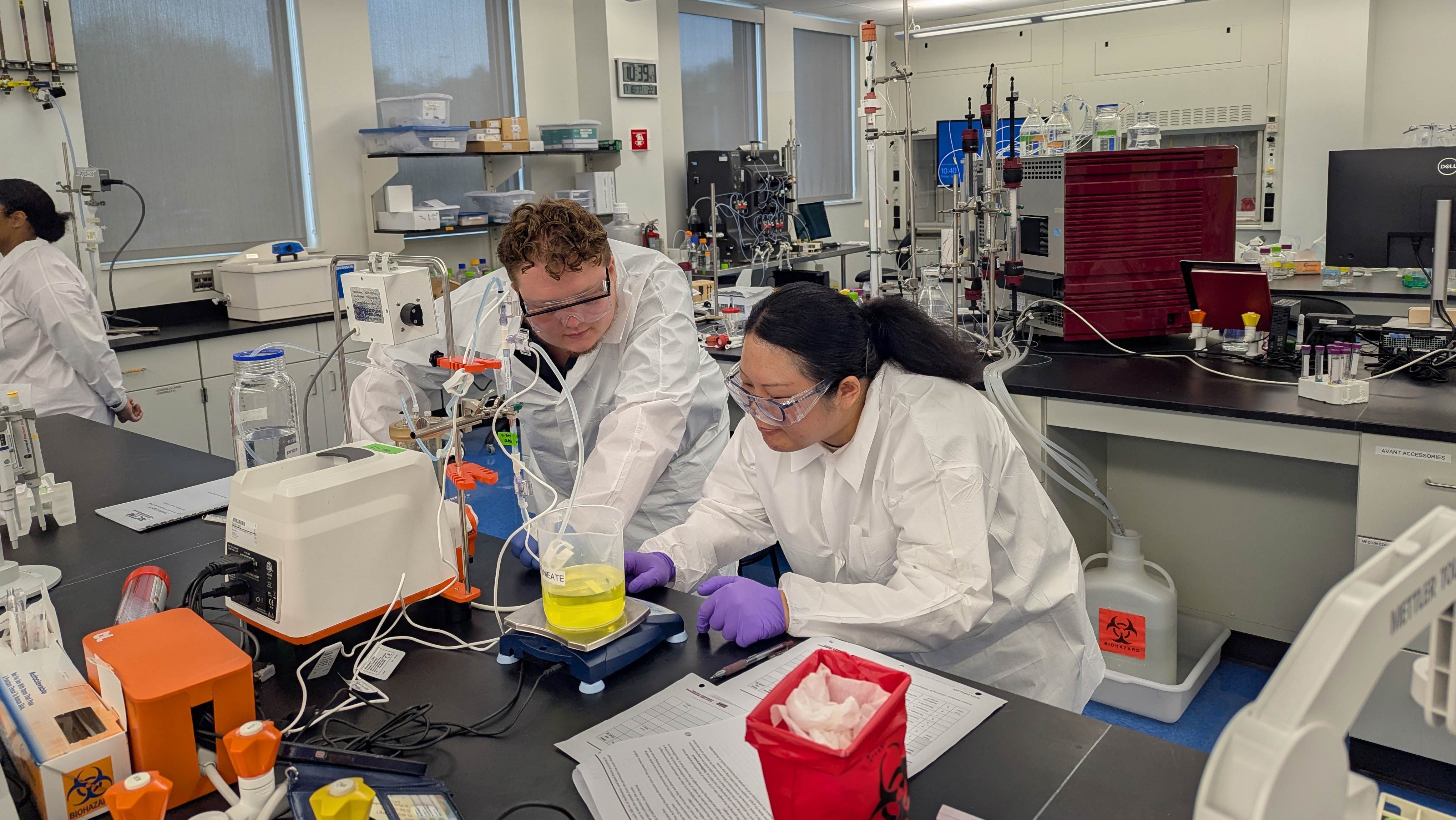 Two students working in a lab.