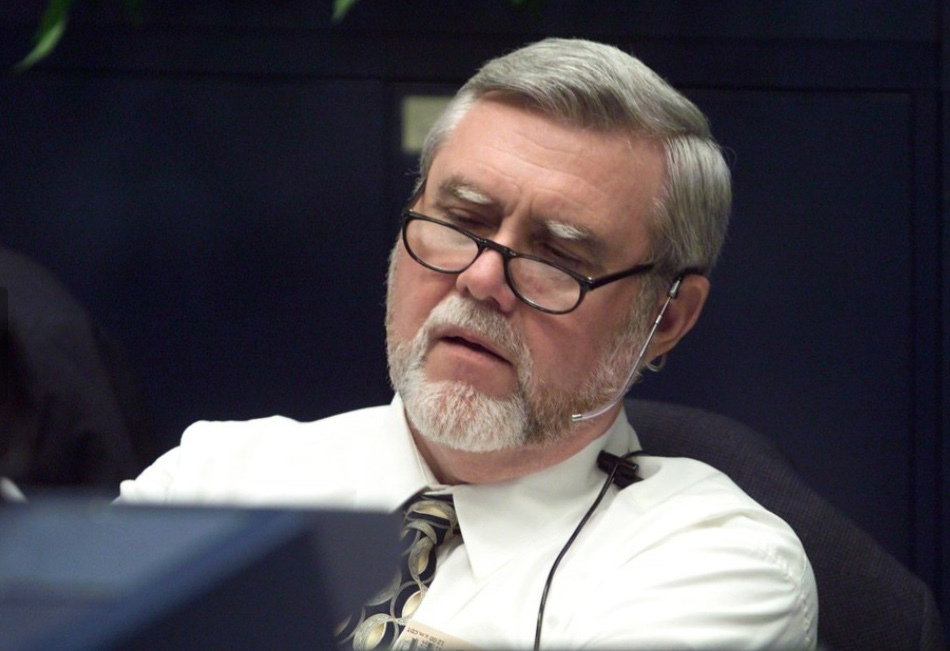 Man sitting at a desk.