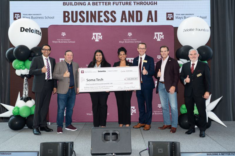 Five individuals in business attire give a thumbs up while two others hold an oversize check.