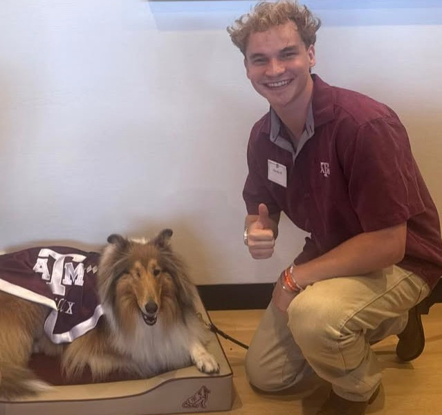 Aiden Ross posing with the Texas A&amp;M University mascot, Reveille.