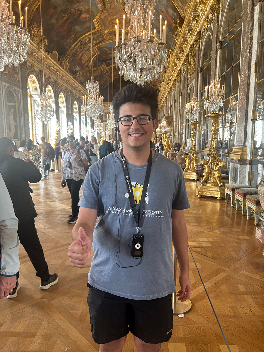 Isaac Cabello posing with his thumbs up.