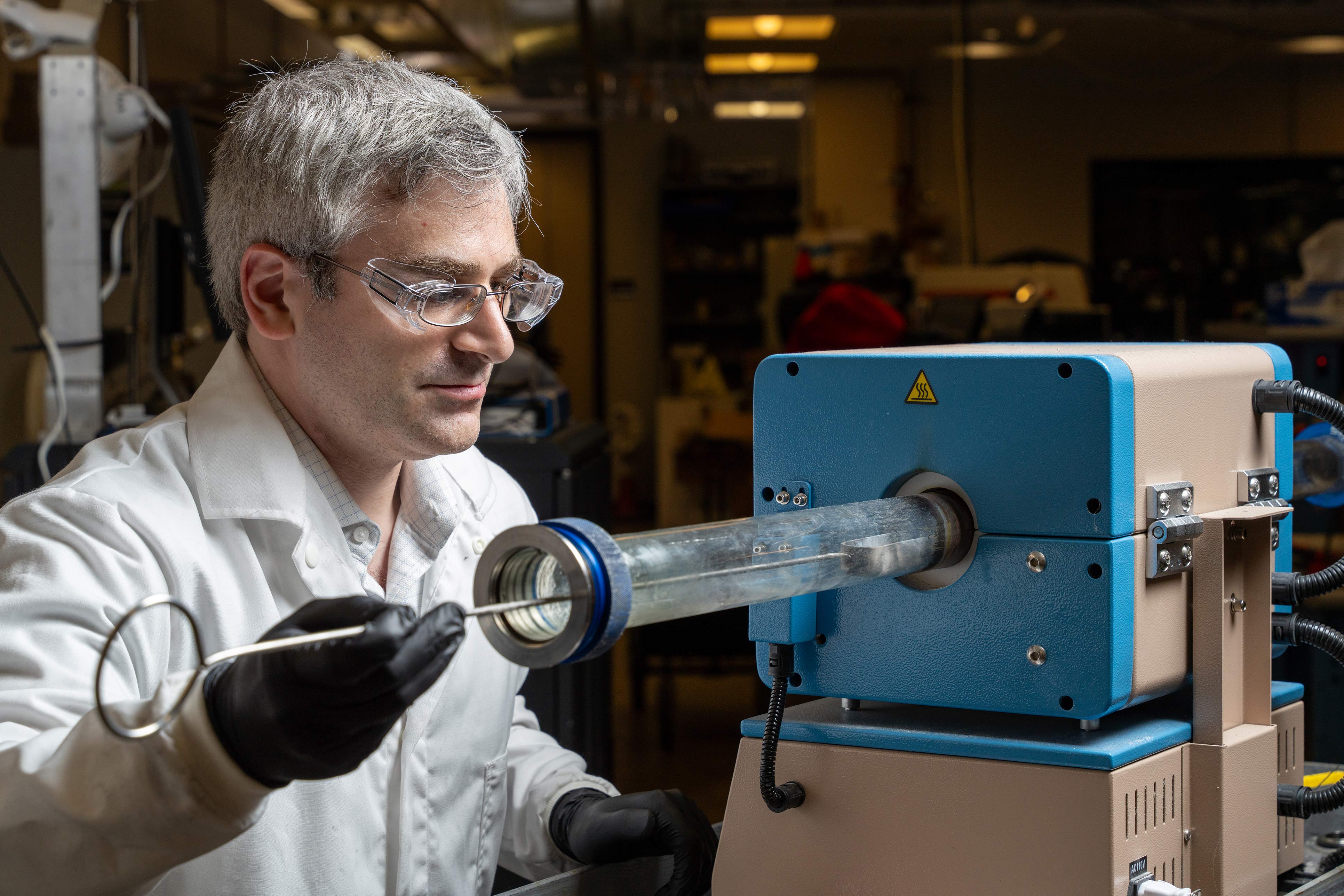 Man working with lab equipment.