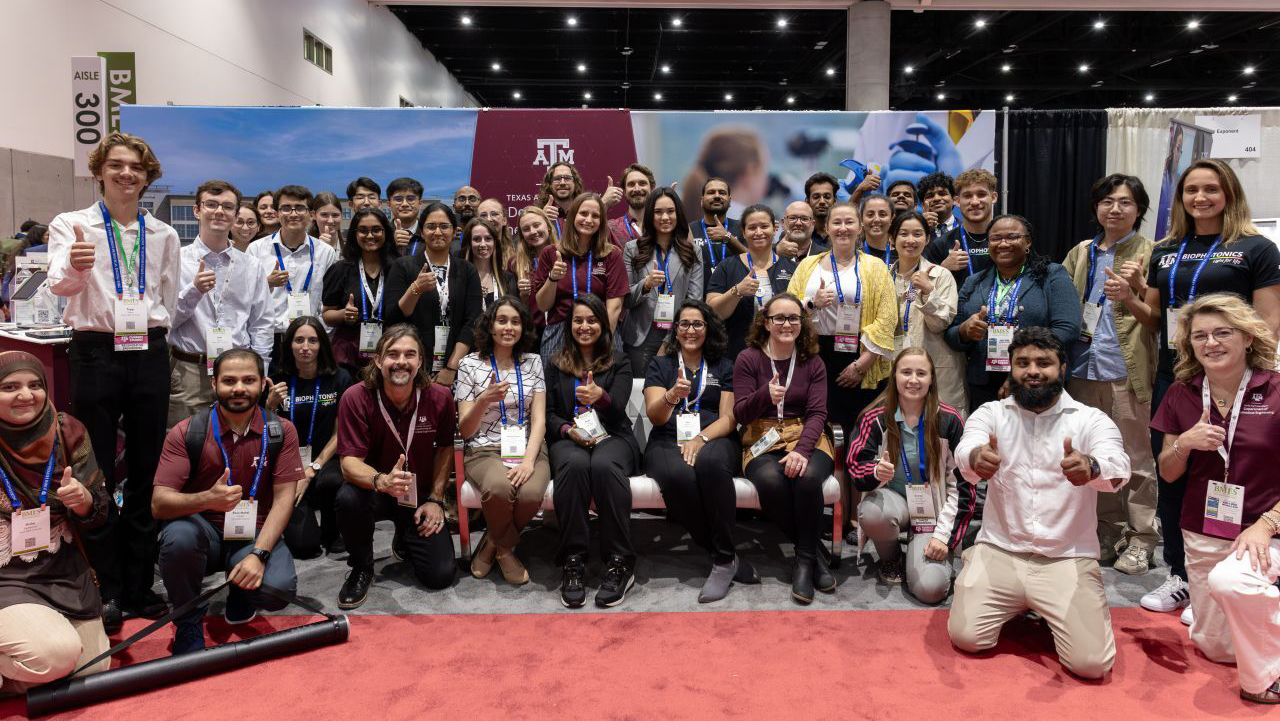 A large group of people pose for a photo.