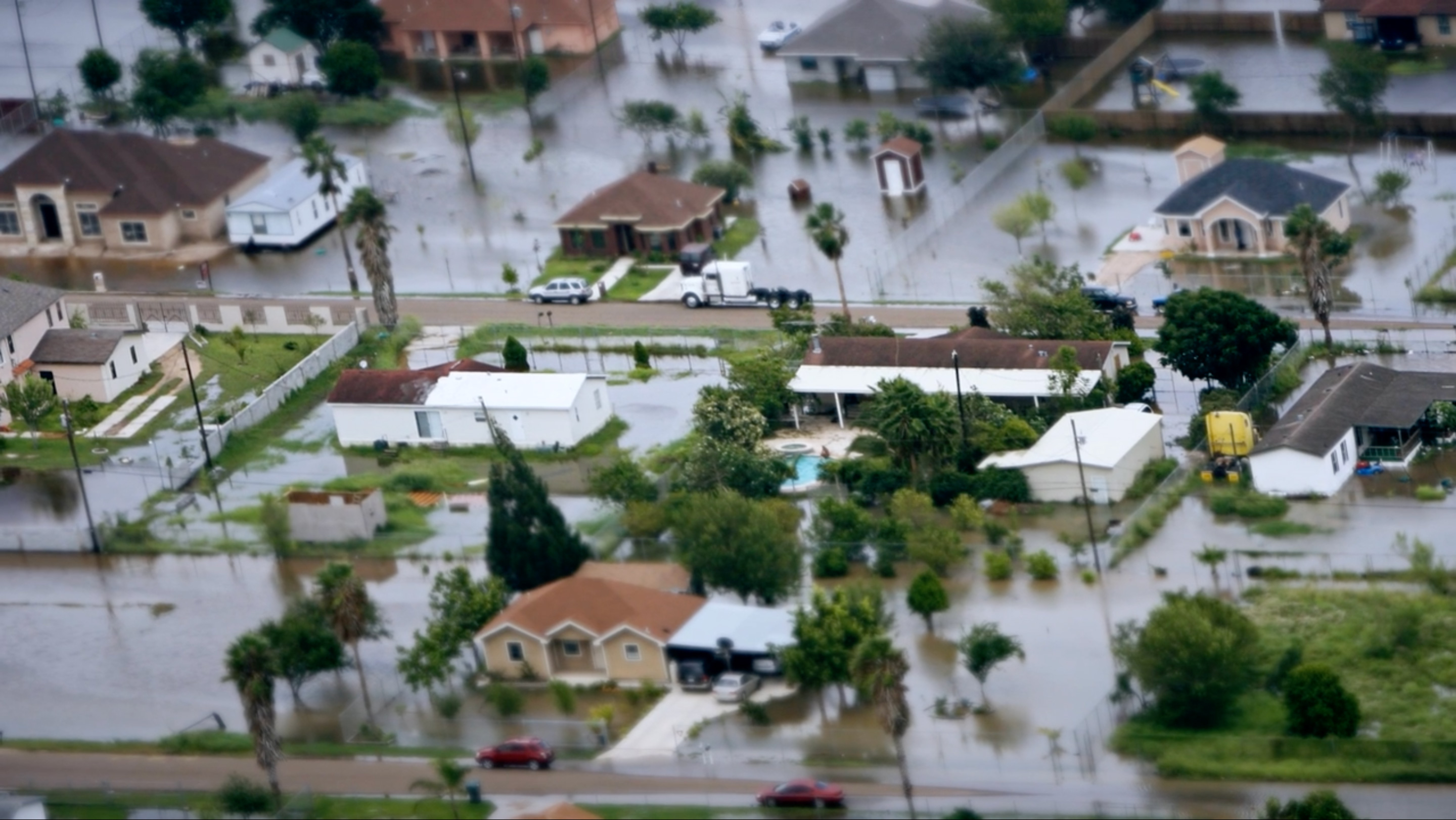 An aerial image of flooding and houses. 