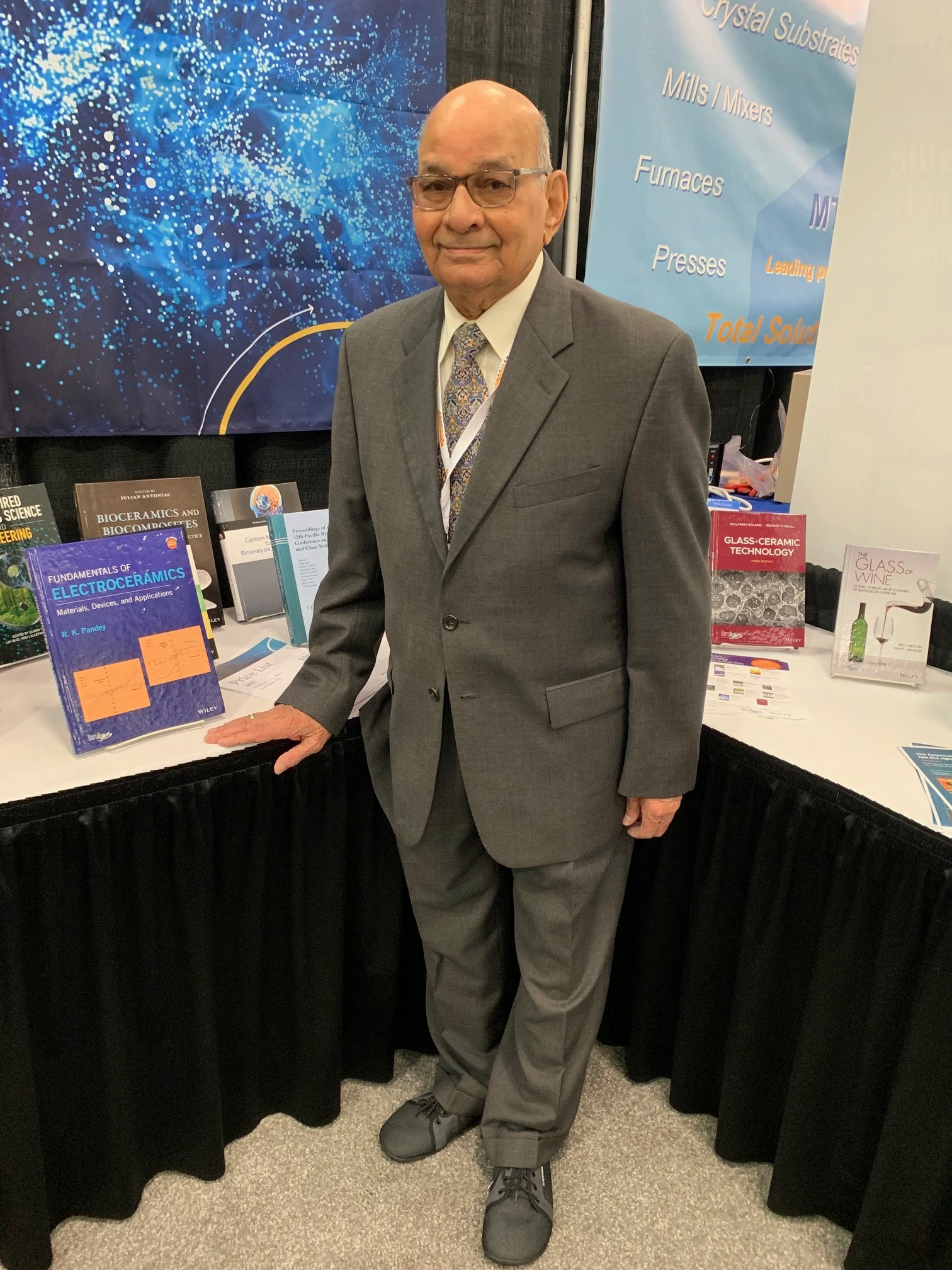 Man standing next to a book.