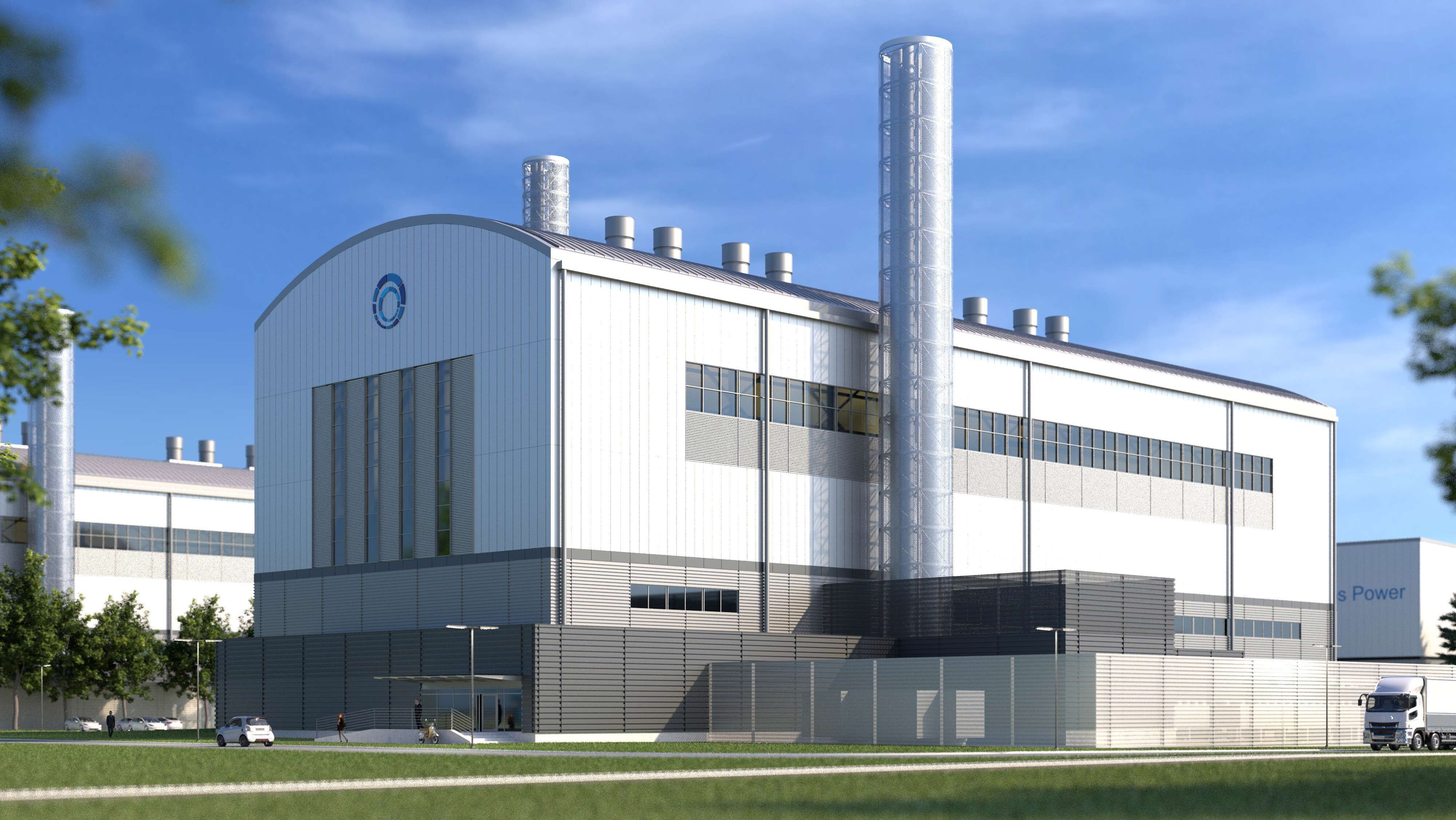 Modern industrial facility with multiple stories and stainless-steel exterior, surrounded by lawn and trees.