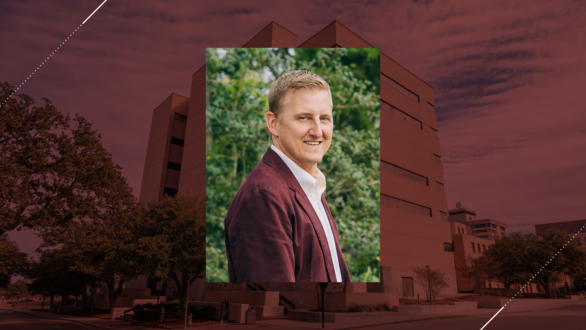Headshot of Dr. Darren J. Hartl on a maroon background.