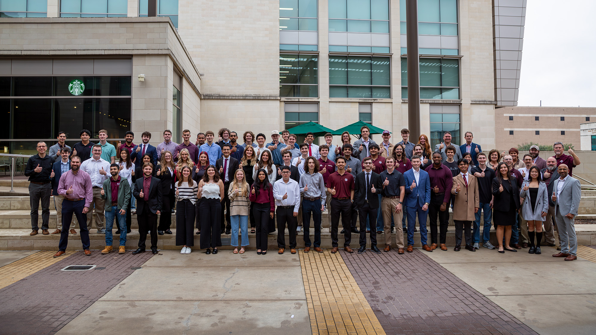 A large group of people standing outside. 