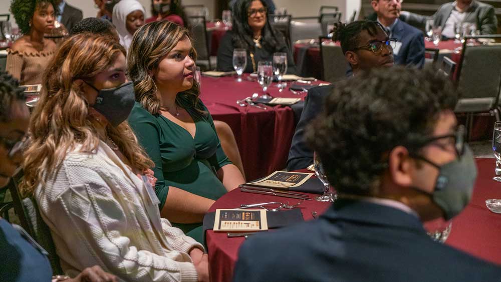 Students sitting at table.