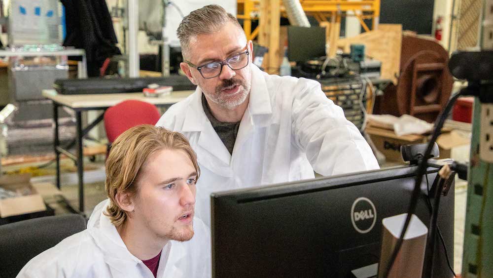 Professor and student working in the lab