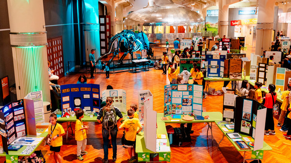 Overhead view of the exhibit floor in the Henry Ford Museum showcasing student invention projects. 