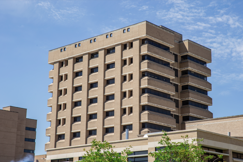 A building stands against a blue sky. 