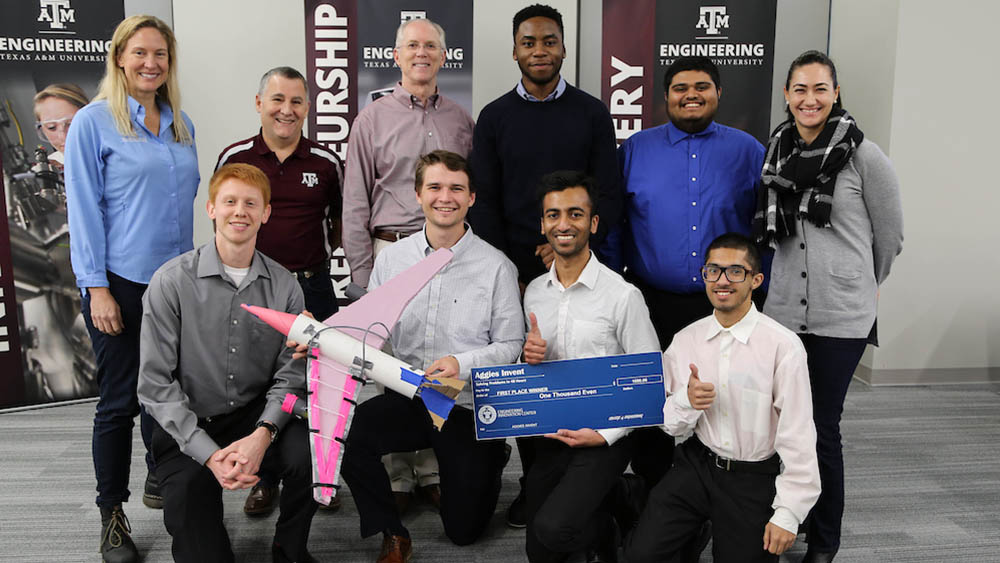 Members of Texas A&M's team pose for a photo