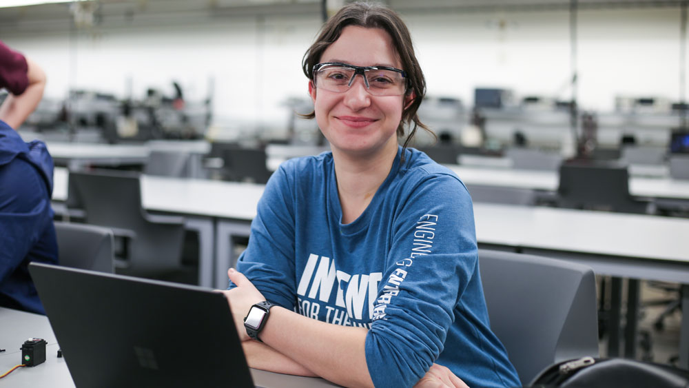 Student in lab with safety goggles during the first round of Invent for the Planet 2022.
