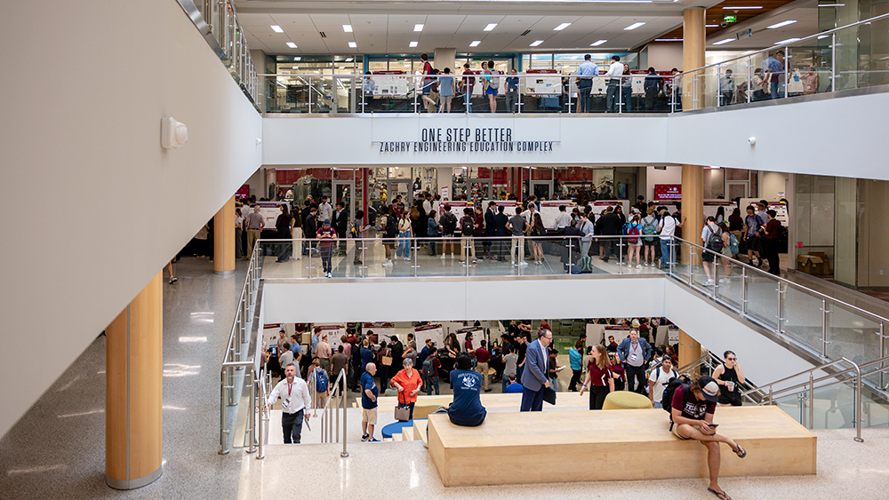 View of three floors of the Zachry Building filled with showcase projects.