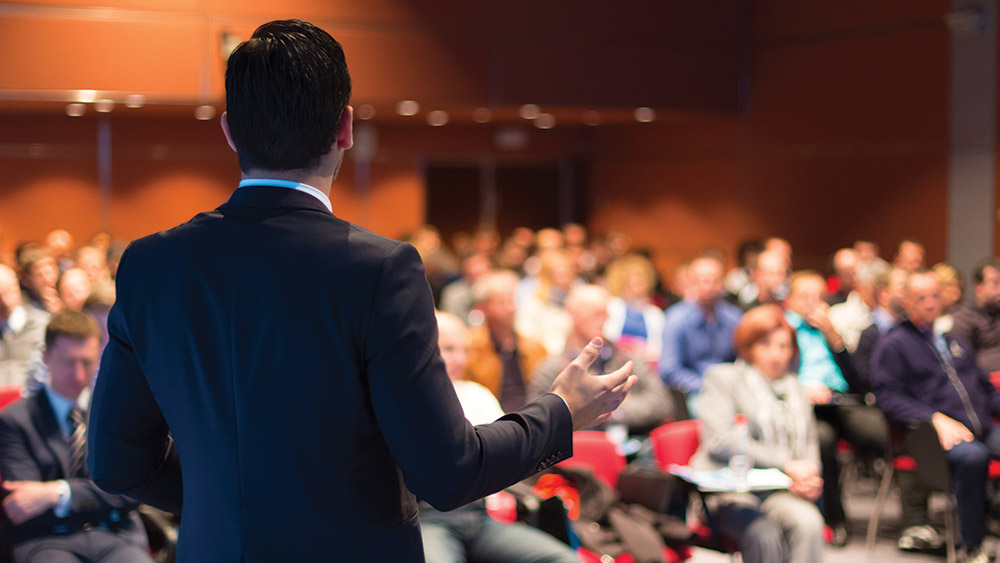 Professor speaking to audience